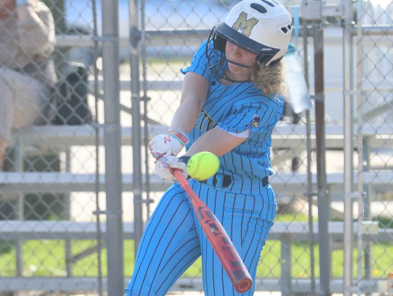 Marquette's Chloe Thrush makes contact with the ball on Thursday, April 23, 2026 at June Cross Field in Ottawa.