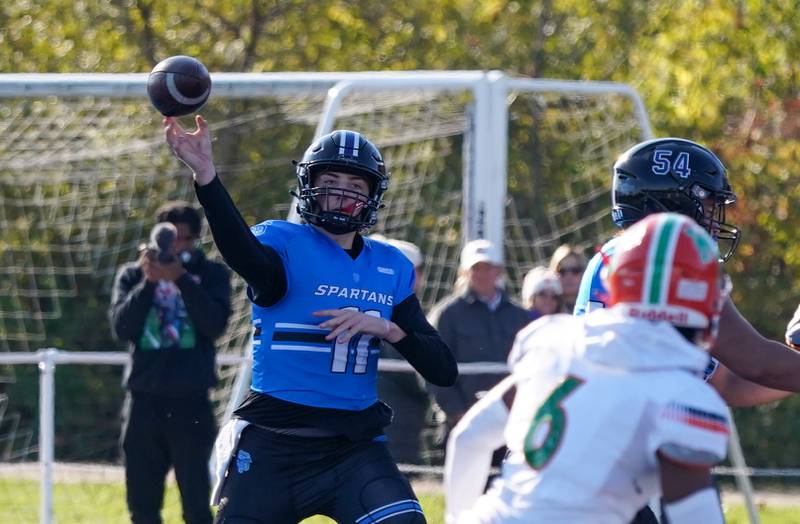 St. Francis' Alessio Milivojevic (11) throws a pass against Morgan Park during a class 5A state quarterfinal football game at St. Francis High School in Wheaton on Saturday, Nov 11, 2023.