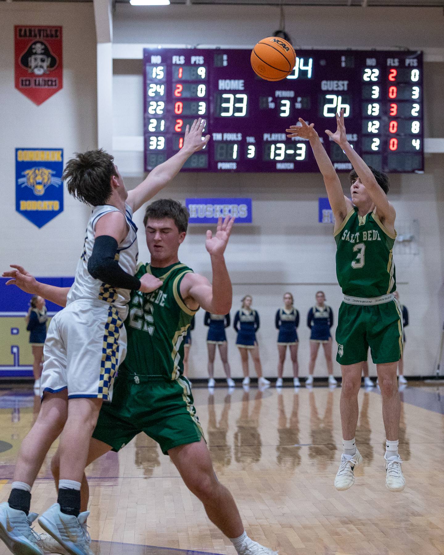 St. Bede's Alec Tomsha (3) shoots 3-pointer as teammate Aj Hermes screens Griffin Dobberstein (22) of Marquette during the Class 1A Regional Boys Basketball Championship game on Friday, Feb. 27, 2026 at Serena High School.