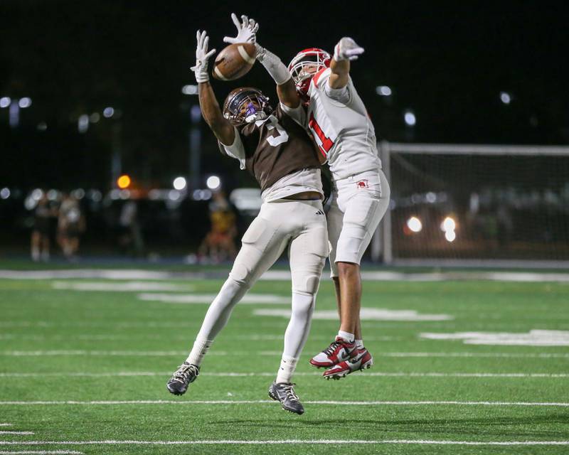 Joliet Catholic's Jayden Armstrong (3) attempts to haul in a pass during a football game between Marist at Joliet Catholic on Friday, Sept 20, 2024,  in Joliet.