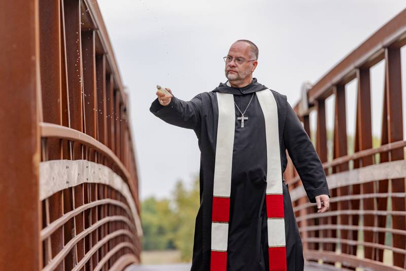 Abbott Michael Calhoun blesses the new Kevin Coleman Bridge after prayers during the ribbon cutting ceremony at 501 3rd Street on September 20, 2025 in Hennepin.
