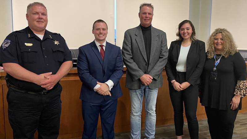 Erika Gutierrez and Nicholas P. Bozek were sworn in as Oswego's newest patrol officers by Village President Troy Parlier, witnessed by Police Chief Burgner and police commissioner Carrie Niesman, at a Village Board meeting April 19. (from left to right: Bergner, Bozek, Parlier, Gutierrez, Niesman) (photo provided)