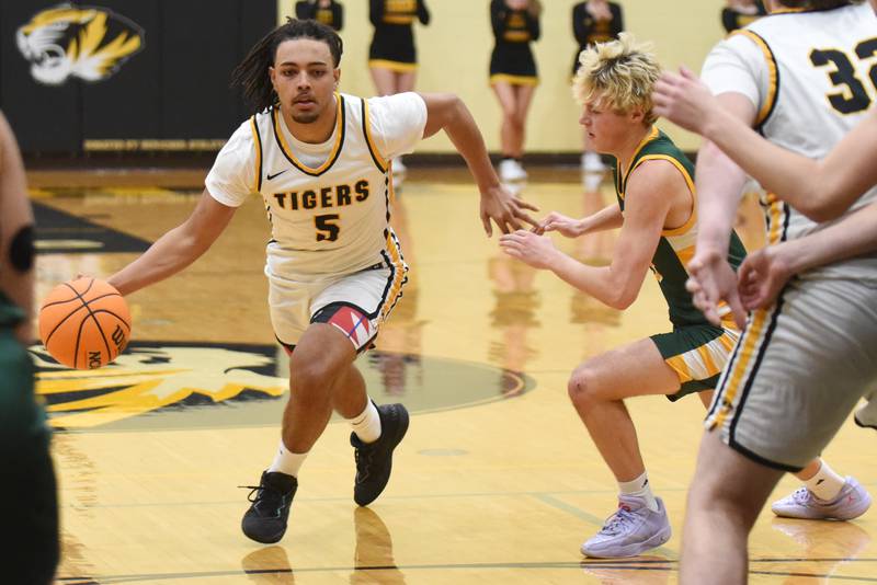 Herscher's Alek Draper, left, drives past Coal City's Dane Noffsinger during a game at Herscher Tuesday, Jan. 27, 2026.