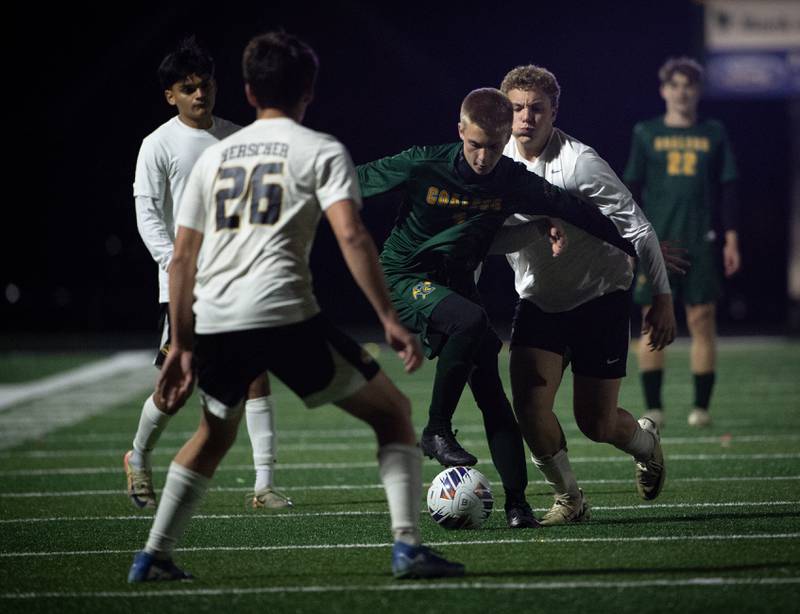Coal City's Dylan Fatlan, center, controls the ball as Herscher's Dawson Langlois, back, challenges during a sectional game on Tuesday, October 28, 2025.