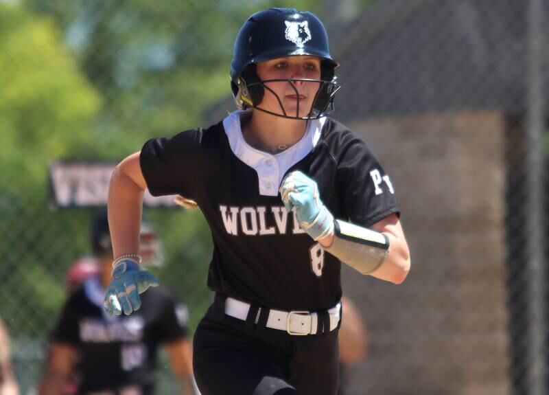 Prairie Ridge’s Ady Kiddy sprints to first after making contact against Harvard during Class 3A softball regional final action at Lions Park in Harvard Saturday.