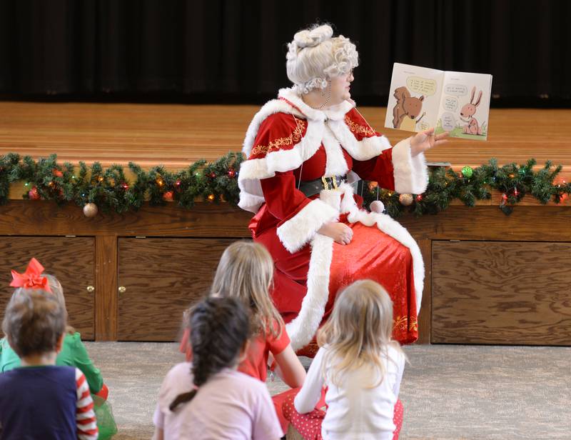 Mrs. Clause reads books to children attending Downers Grove Park District's Candy Cane Lane event Saturday, Dec. 2, 2023.