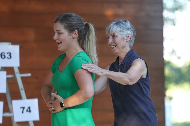 Shirley Bodett, right, was pulled from the audience to help Miriam Naponelli with an improv for the GreenRoom Improv show hosted by the Morris Library at Goold Park on Friday, Aug. 11, 2023 in Morris.
