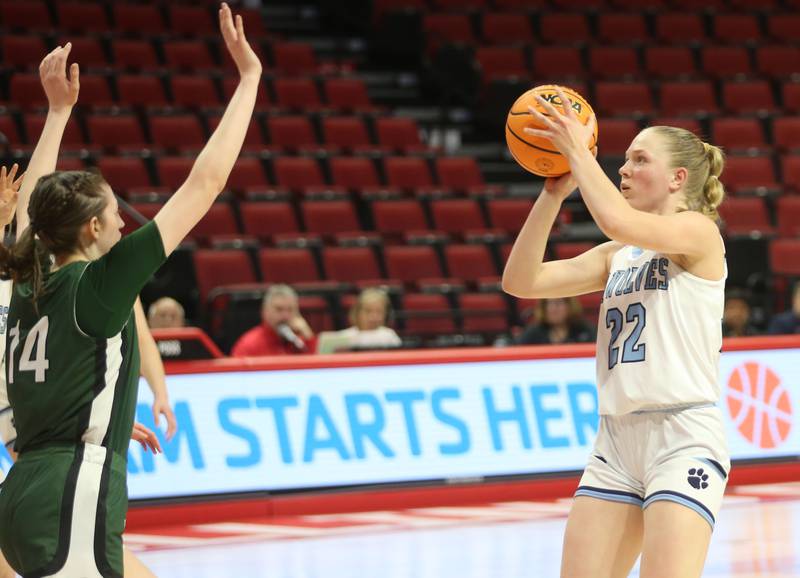 Cissna Park's Josie Nukomm fires a wide-open three over St. Edward's Amelia Davis during the Class 1A third place game on Friday, March 7, 2025 at CEFCU Arena in Normal.