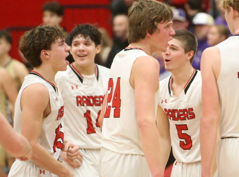 Earlville's Trenton Fruit (left) reacts with teammates Oliver Munoz, Ryan Browder and Carlos Gonzalez after hitting a buzzer beater shot to end the third quarter against Serena on Friday, Feb. 9, 2024 at Earlville High School.