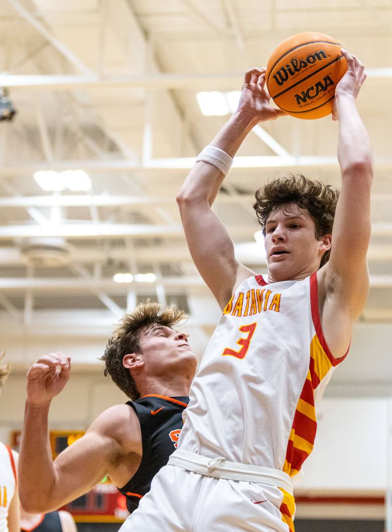 Batavia guard Jax Abalos grabs a rebound during a home game against Wheaton Warrenville South on Tuesday, Jan. 7, 2025.