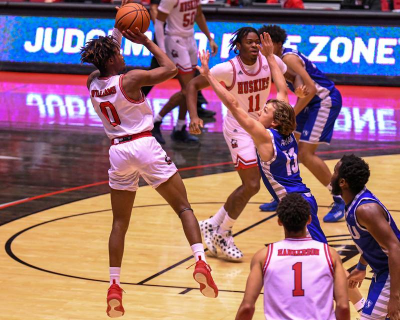 File photo - Northern Illinois University men's basketball guard Keshawn Williams (0) takes a shot Tuesday, Dec. 1, 2021 while being defended by Eastern Illinois in the second half in DeKalb.