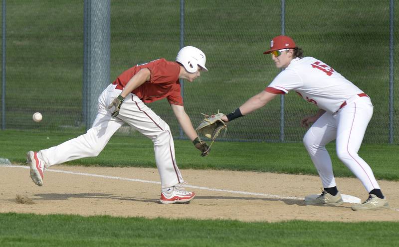 LaSalle Peru’s Braylon Bond gets back to 1st ahead of the ball as Ottawa’s Brendyn Fuchs awaits the throw om a pickoff play Monday at Ottawa.