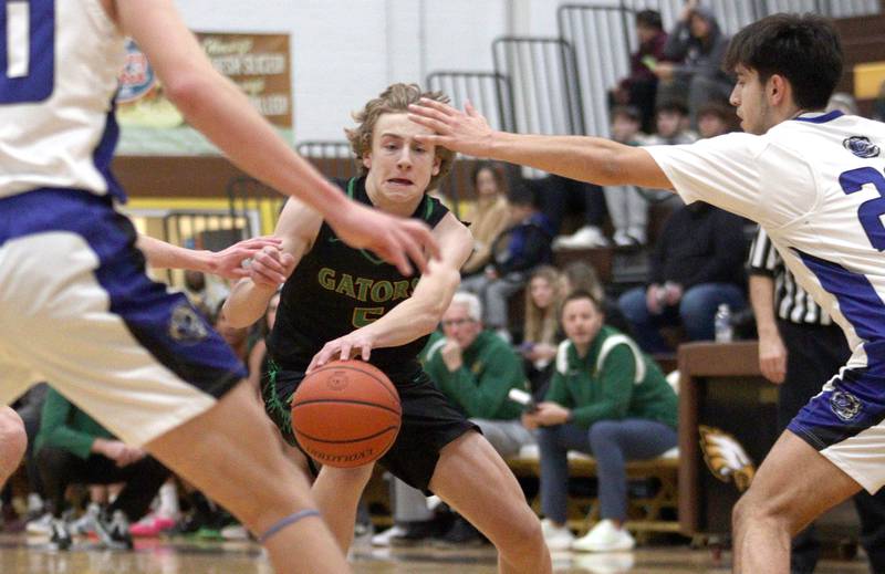 Crystal Lake South’s Carson Trivellini navigates traffic against Lake Zurich in Hinkle Holiday Classic boys basketball tournament game action at Jacobs High School Wednesday.