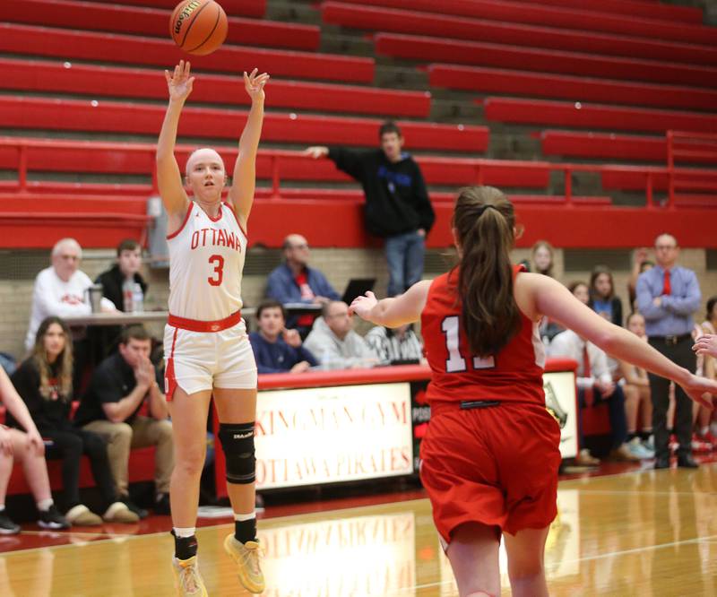 Ottawa's Skylar Dorsey shoots a three-point basket over Streator's Kora Lane during the Lady Pirate Holiday Tournament on Wednesday, Dec. 20, 2023 in Kingman Gym.