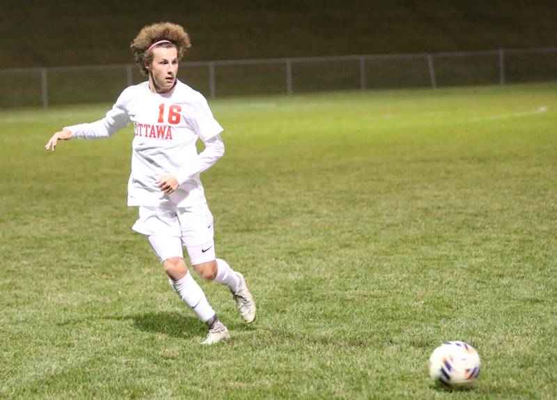 Ottawa's Ian Fulkerson passes the ball off during the Class 2A Regional semifinal game on Monday, Oct. 20, 2025 at Ottawa High School.