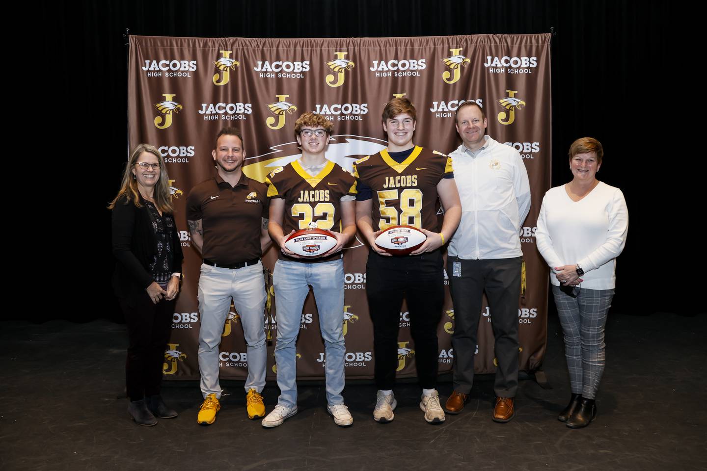 From left: District 300 superintendent Susan Harkin, football coach Brian Zimmerman, junior Dylan Christopherson, junior Will Seibert, athletic director Joe Benoit and Jacobs principal Barb Valle.