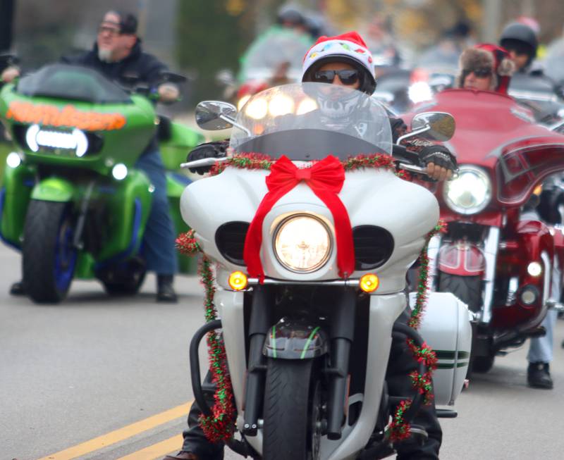 Motorcyclists cruise during the Toys for Tots Parade on Sunday, Nov. 24, 2024, in downtown McHenry.