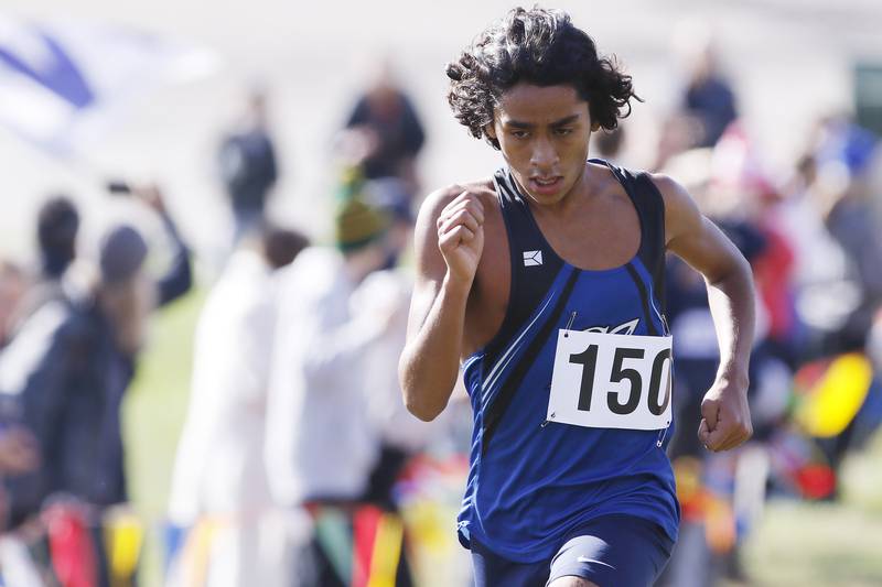 Burlington Central's Yusuf Baig heads for the finish line to place second during the boys Class 2A Woodstock North XC Sectional at Emricson Park on Saturday, Oct. 30, 2021 in Woodstock.