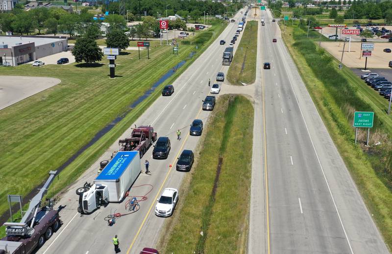 Crews work the scene of a semi truck crash on Friday, June 14, 2024 near the intersection of 38th Street and Illinois 251 in Peru. A Goodwill semi truck overturned and extrication was needed. The crash happened shortly before 11:30a.m. Illinois Route 251 was down to one lane. Peru police believe injuries were not serious.