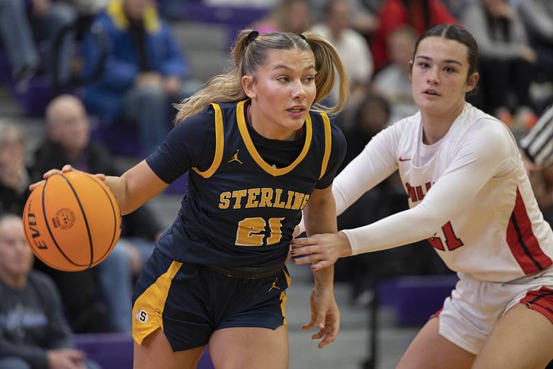Sterling’s Jaelynn James drives against Stillman Valley’s Emma Withers Saturday, Dec. 27, at the Duchesses Basketball Christmas Classic.