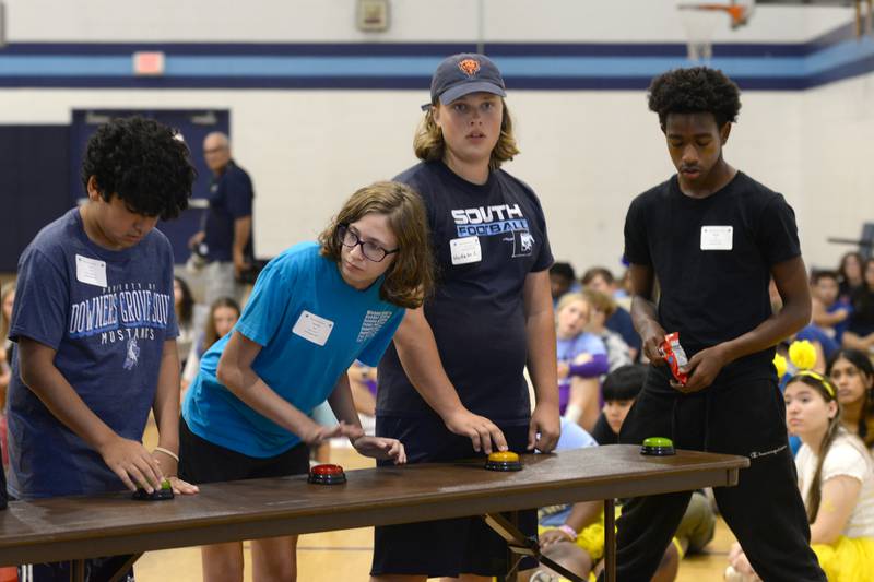 Downers Grove South High School students (left-right) Laith Yasin, Caroline Kelly, Hudson Zebraitis and Deonte Jeff play Mad Dash Jeopardy during Freshman orientation  Saturday Aug 19, 2023.