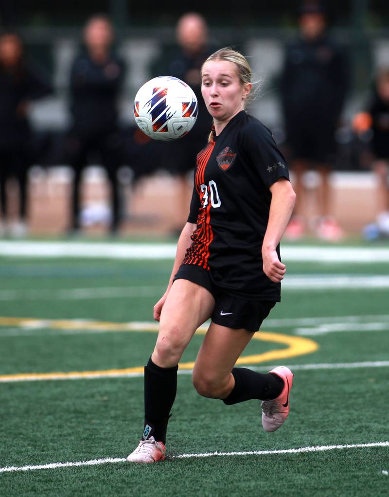 St. Charles East's Lilli Margewich goes after the ball during a Class 3A Glenbard West Sectional semifinal game against St. Charles North on Tuesday, May 27, 2025 in Glen Ellyn.