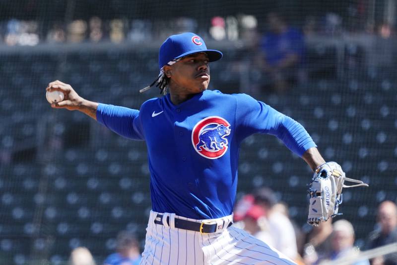Chicago Cubs starting pitcher Marcus Stroman throws against the Texas Rangers during the first inning of a spring training game Friday, March 24, 2023, in Mesa, Ariz.
