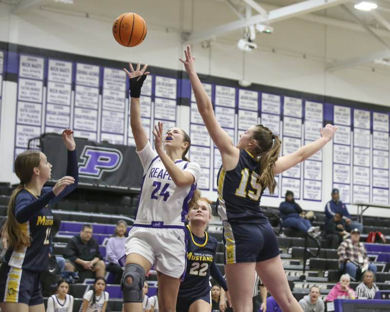 Plano's Chloe Rowe (24) puts in a layup during their basketball game between Yorkville Christian at Plano Wednesday, Jan 07, 2026 in Plano.