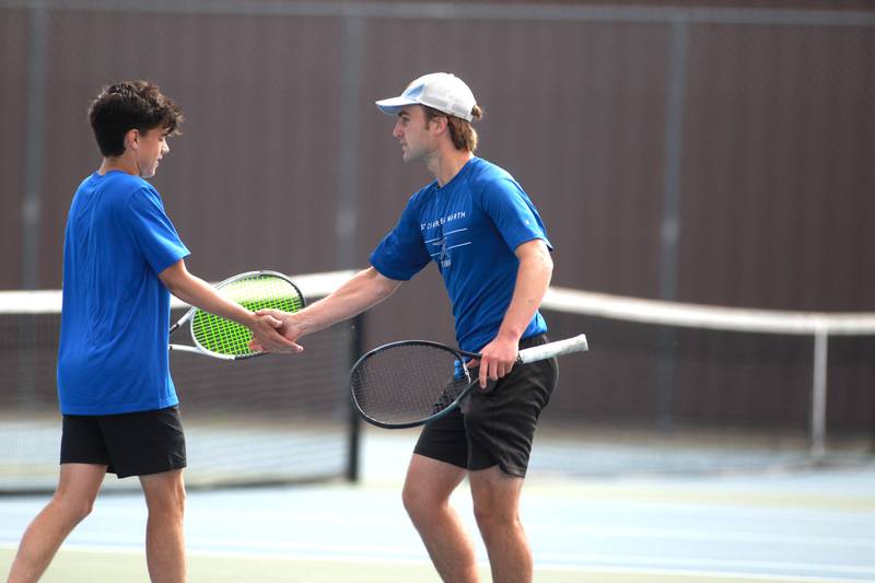 St. Charles North doubles partners Ben Goddard (left) and Cole Weddle celebrate a point during the first round of the 2A boys state tennis meet on Thursday, May 29. 2025 at Hersey High School.