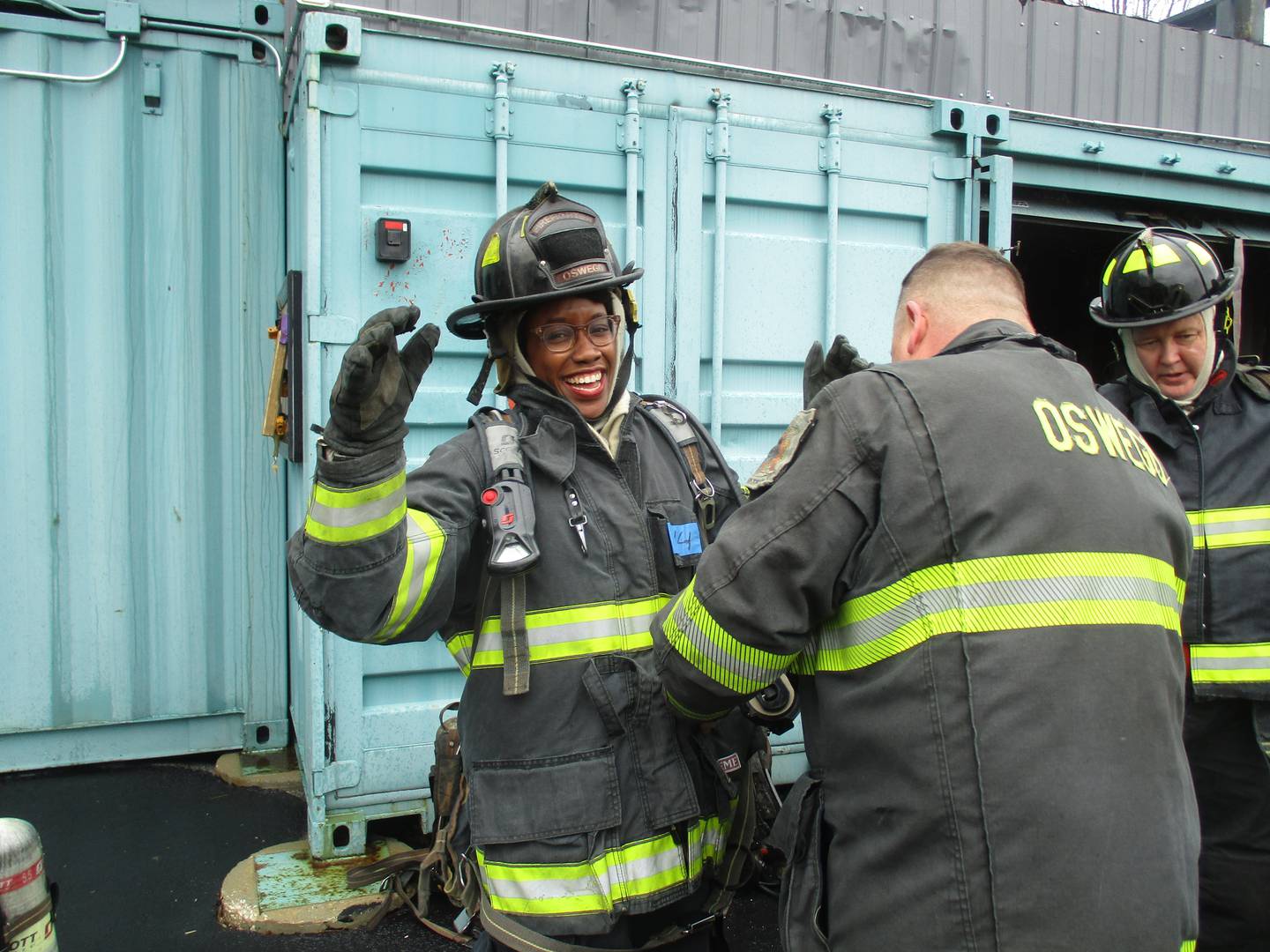 U.S. Rep Lauren Underwood, D-Naperville, gets some assistance adjusting her firefighting gear during a training session with the Oswego Fire Protection District on March 19, 2022. (Mark Foster -- mfoster@shawmedia.com)