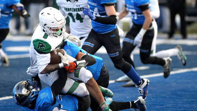 Providence’s Mason Santiago is taken down by the St. Francis defense during their Class 4A semifinal game in Wheaton on Friday, Nov. 19. 2022.