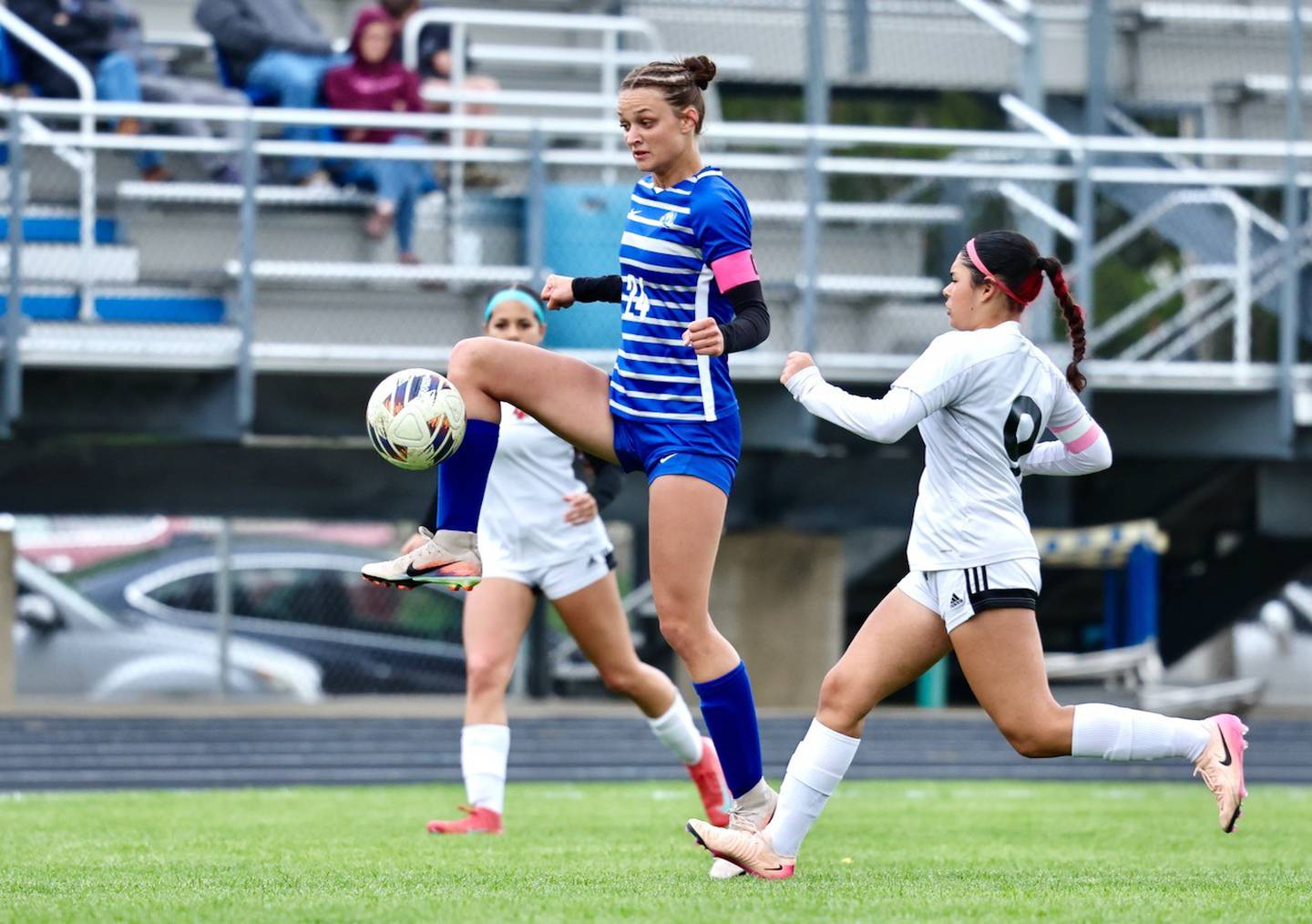 Princeton's Keighley Davis gets a leg up on L-P's Sofia Nanez Thursday night at Bryant Field. Davis scored a goal in the Tigresses'  4-1 win.