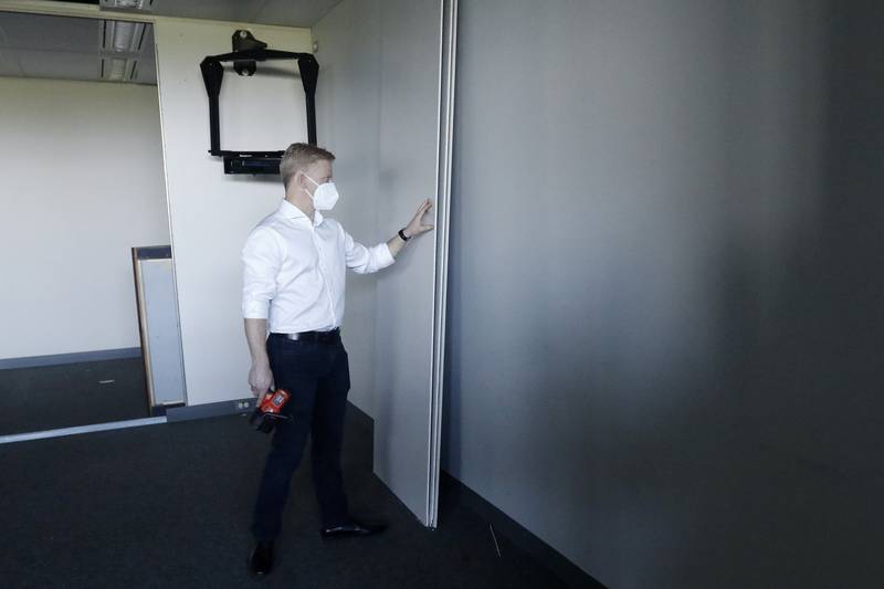 Sean Stofer, COO of Green Data Center Real Estate, Inc.,  shows the partition walls inside the property at the former Motorola headquarters on Thursday, June 10, 2021 in Harvard.