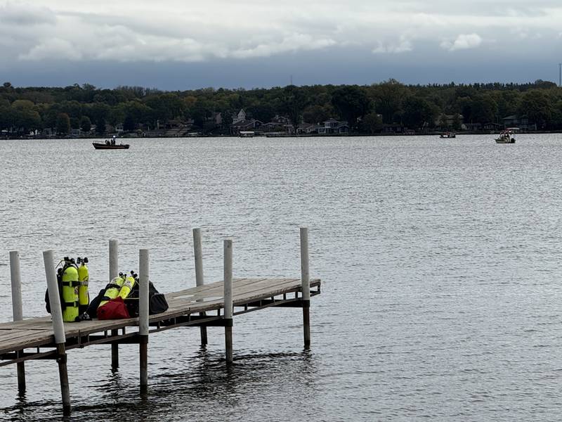 Searchers from the Antioch Fire Protection District and Illinois Department of Natural Resources continue to search on Tuesday, Oct. 7, 2025, on Fox Lake near Antioch for a man thrown from a boat he was test driving Monday night.