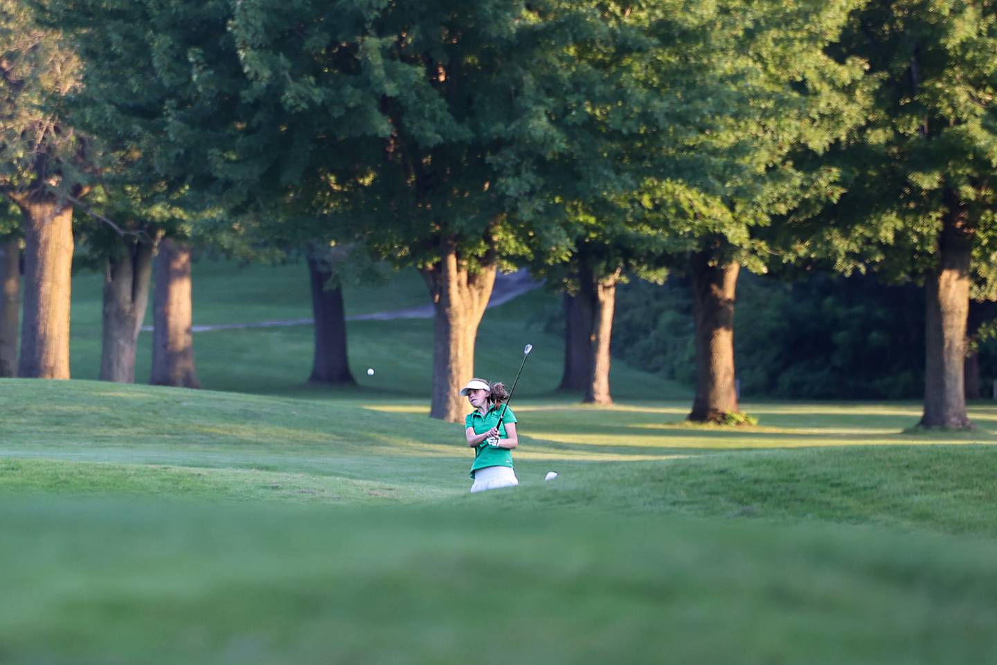 Bishop McNamara's Maggie Manes hits toward the green during the Fightin' Irish's 219-235 loss to Bradley-Bourbonnais in the All-City matchup at the Kankakee Elks Country Club on Thursday, Aug. 28, 2025.