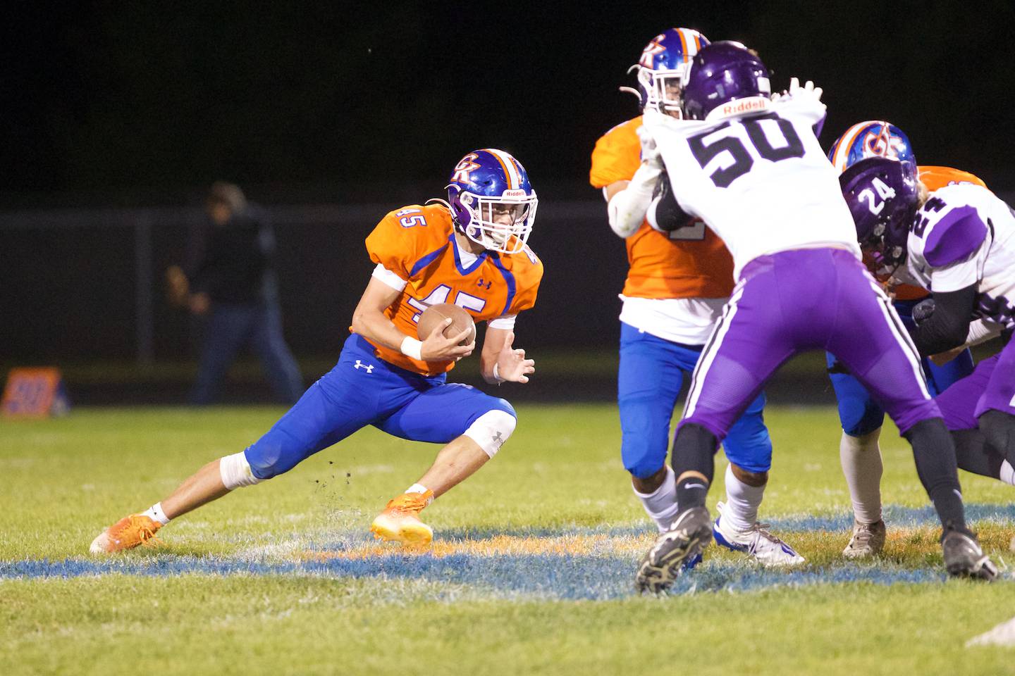 Genoa - Kingston's Maddox Lavender looks for running room against Dixon on Friday Oct.7,2022 in Genoa.