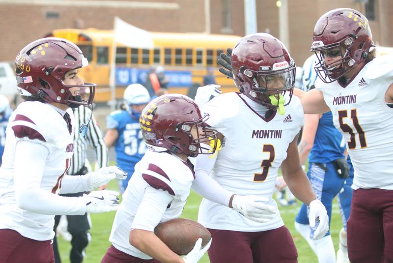 Montini Catholic players Nico Castaldo, Santino Florio, JoJo James and Dario Mattiuz celebrate after scoring the first touchdown against Princeton during the Class 3A quarterfinal game on Saturday, Nov. 16, 2024 at Bryant Field in Princeton.