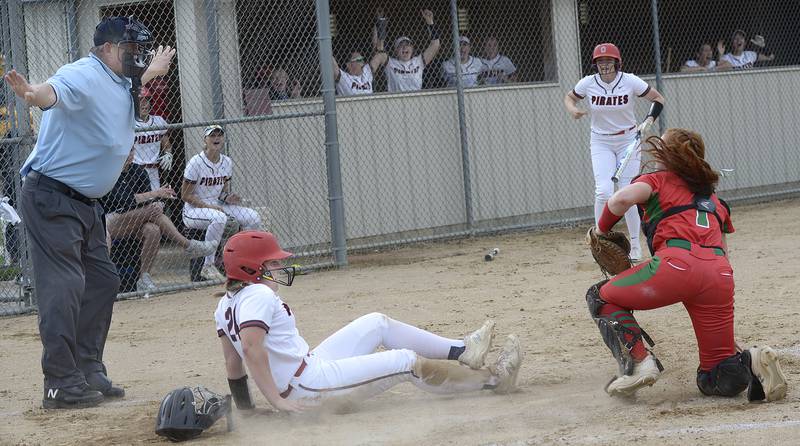 Ottawa’s Bobbi Snook is called safe after beating the tag by La Salle Peru catcher Addison Duttlinger in the 1st inning Wednesday at Ottawa.