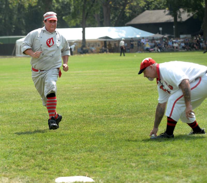 Oregon Ganymede Justin Early looks to avoid the tag as he heads to third base while a Bay City Independent player fields the throw at the World Tournament of Historic Base Ball held at the Henry Ford Museum's Greenfield Village on Saturday, Aug. 9, 2025.
