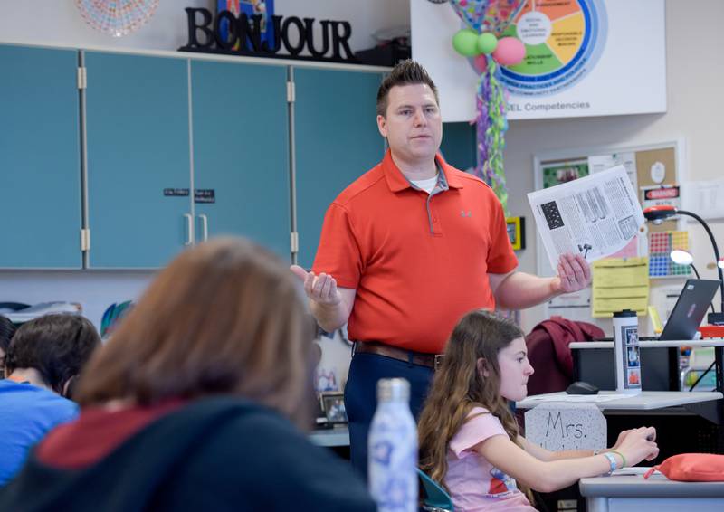 Patrick McGuire leads a seventh grade social studies class at Wredling Middle School on Tuesday, March 15, 2022.
McGuire, a former assistant principal, decided to return to the classroom this year at Wredling Middle School in St. Charles in order to reconnect with students.