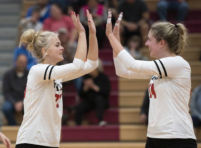 Huntley's Allyson Panzloff, left, and Avary DeBlieck celebrate a point during their victory against Burlington Central on Tuesday, October 4, 2022 at Huntley High School. Ryan Rayburn for Shaw Local