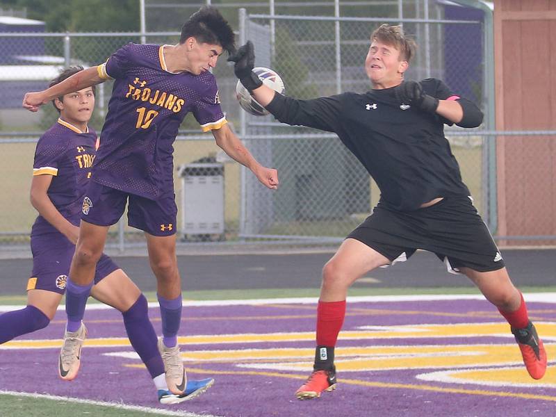 Mendota's Johan Cortez puts a header on the ball to teammate Isaac Diaz (left) over the arm of Streator keeper Andrew Vogel to score a goal on Monday, Sept. 23, 2024 at Mendota High School.
