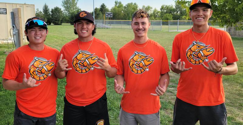 Illinois Valley Pistol Shrimp players (from left) Cody Kashimoto, Xander Sielken, Toby Jackson, Kedren Kinzie all born and raised in Hawaii pose for a photo while holding "Shaka" signs which means "hang loose or right on" in Hawaiian culture on Tuesday, Aug. 2, 2023 at Schweickert Stadium on Tuesday, Aug. 2, 2023 in Peru.