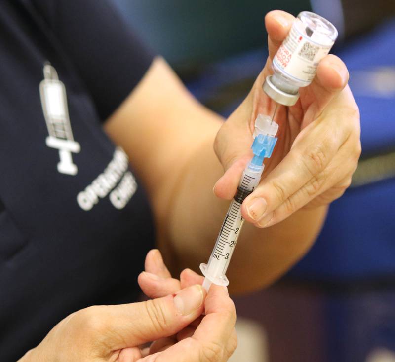 A syringe is filled with COVID-19 vaccine during the DeKalb County Health Department clinic Thursday at Sandwich High School.