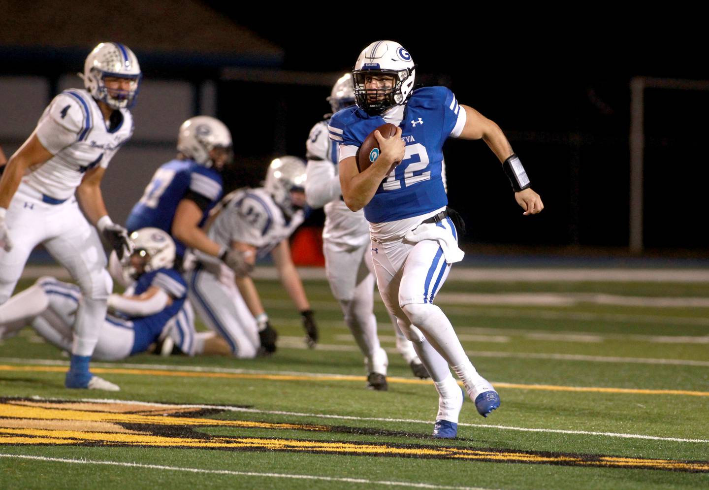 Geneva quarterback Tony Chahino runs the ball on Friday, Oct. 25, 2024 during a game against St. Charles North at Geneva.