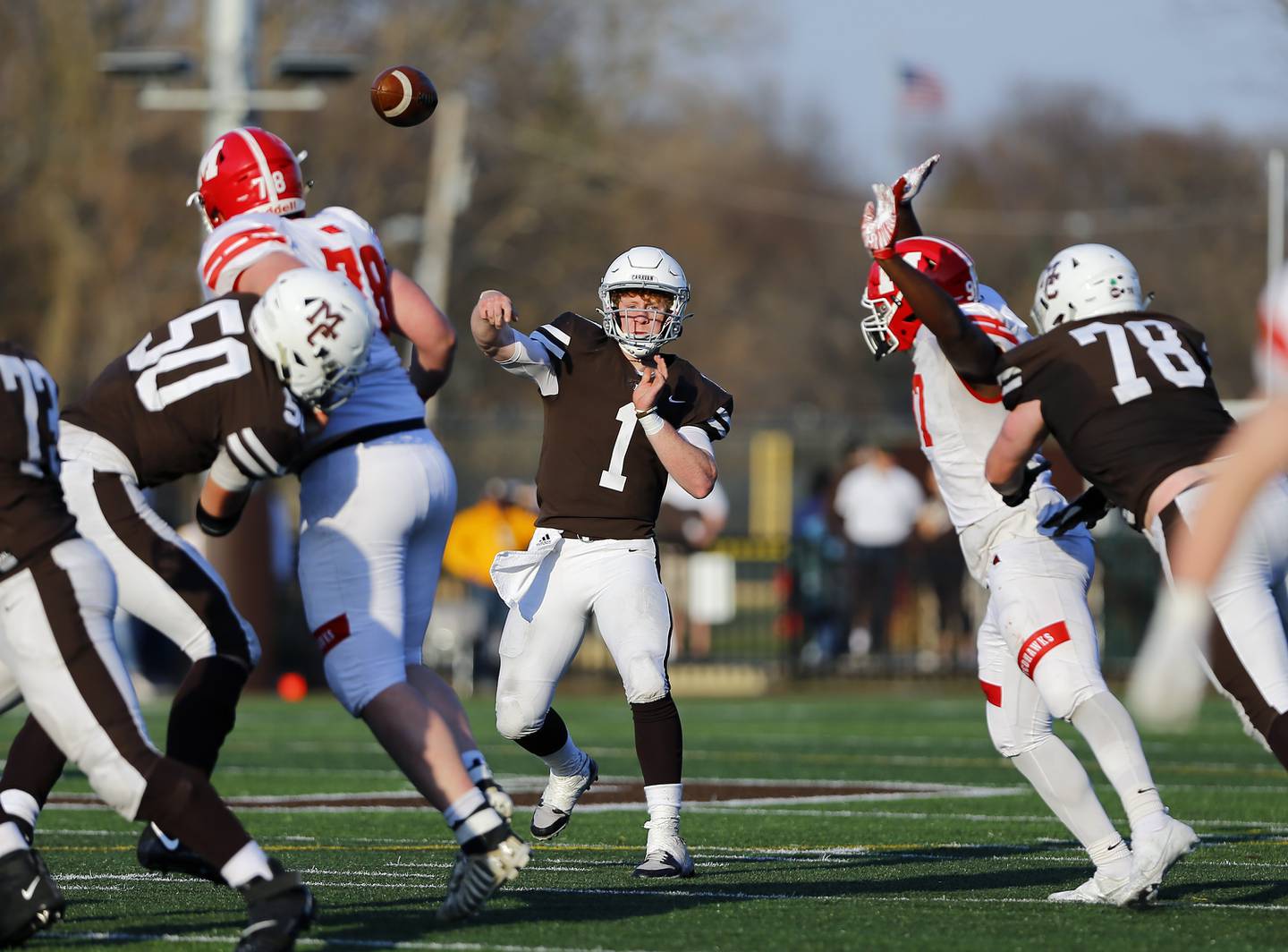 Mount Carmel's Justin Lynch passes the ball as the Marist RedHawk faced the Mount Carmel Caravan on Saturday, April 3, 2021 on Carey Field at Barda-Dowling Stadium in Chicago, IL. Mt. Carmel won 24-21.