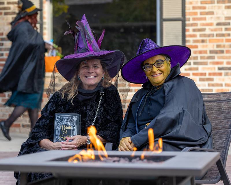 (from left) Kathy Noble and Janis Land pose for a photo at the annual Witches Walk on Friday, Oct. 17, 2025,  at the Market on Mill in Utica.