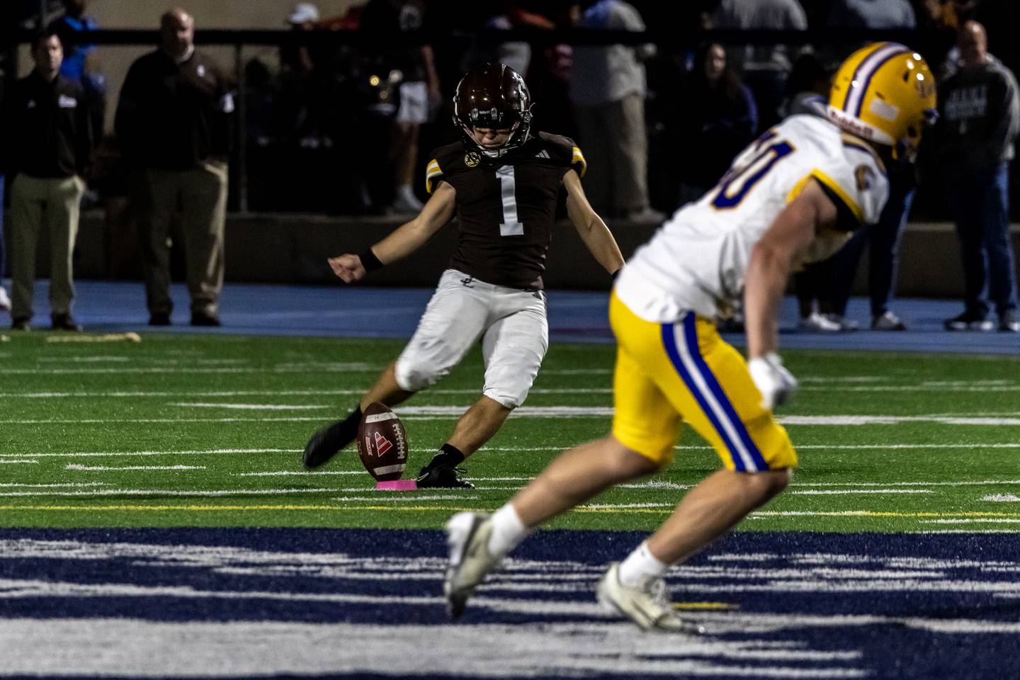 Joliet Catholic's Vinny DiNovo delivers the opening kick-off during a varsity football game against Lyons Township at Busey Bank Field at Joliet Memorial Stadium on Aug. 29, 2025.