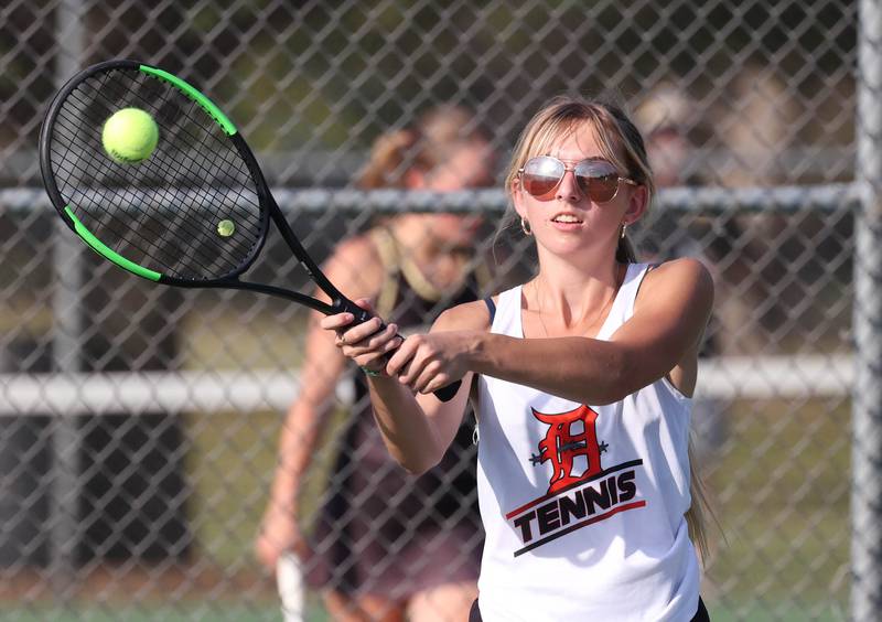 DeKalb’s Alissa Kocjan hits a shot during her doubles match against Sycamore Wednesday, Sept. 18, 2024, at Sycamore High School.