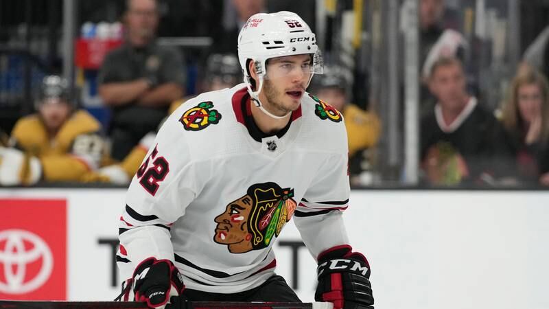 Chicago Blackhawks center Reese Johnson (52) plays against the Vegas Golden Knights during an NHL hockey game in Las Vegas. (AP Photo/John Locher)